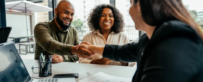 Homebuyer shakes hands with a real estate agent during a Choose the realtor in Prescott AZ consultation in Prescott AZ