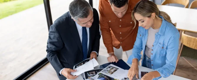 Homebuyers review property documents with a real estate agent during Preparation & Planning in Prescott AZ