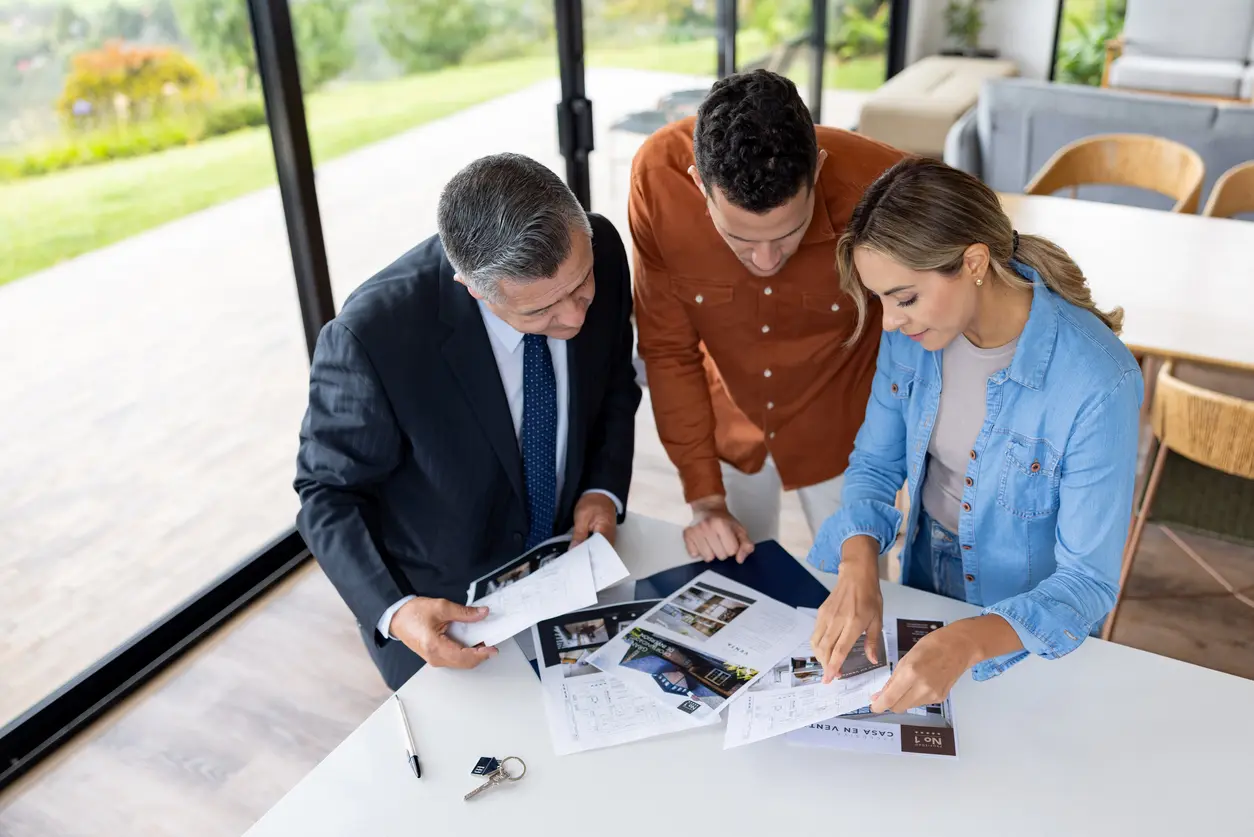 Preparation & Planning Prescott AZ Homebuyers review property documents with a real estate agent during Preparation & Planning in Prescott AZ