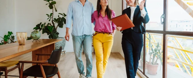 Real estate agent showing an apartment to a couple.